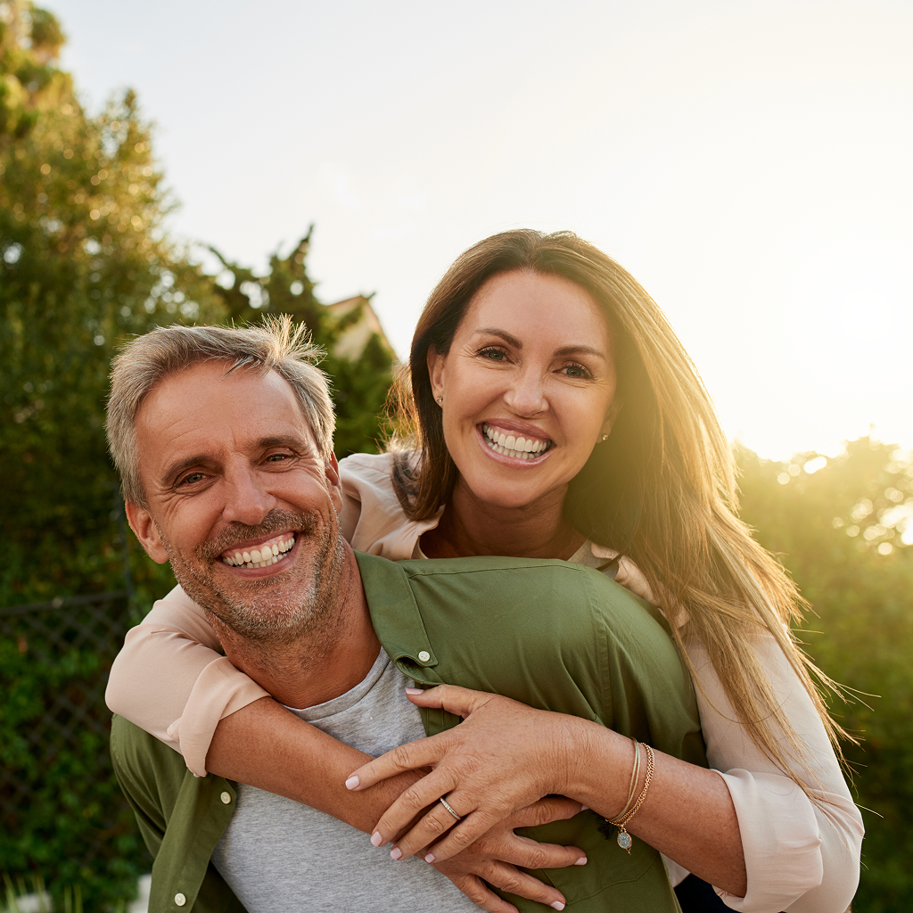 Cropped portrait of a handsome mature man piggybacking his beautiful wife outside